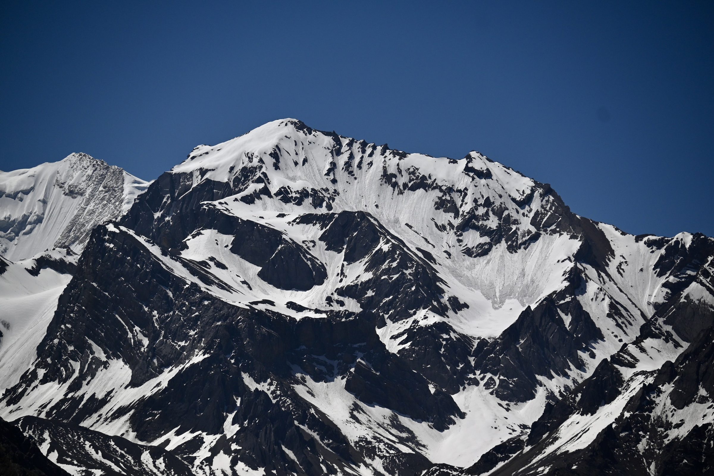 Snow forming the sacred symbol ॐ on the face of Om Parvat